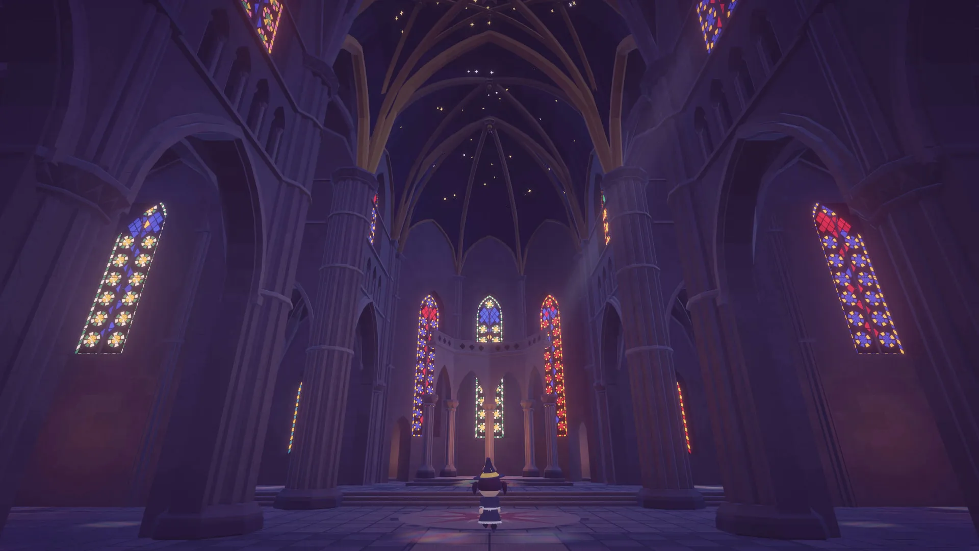 The ribbed vault of the cathedral ceiling with stained-glass windows